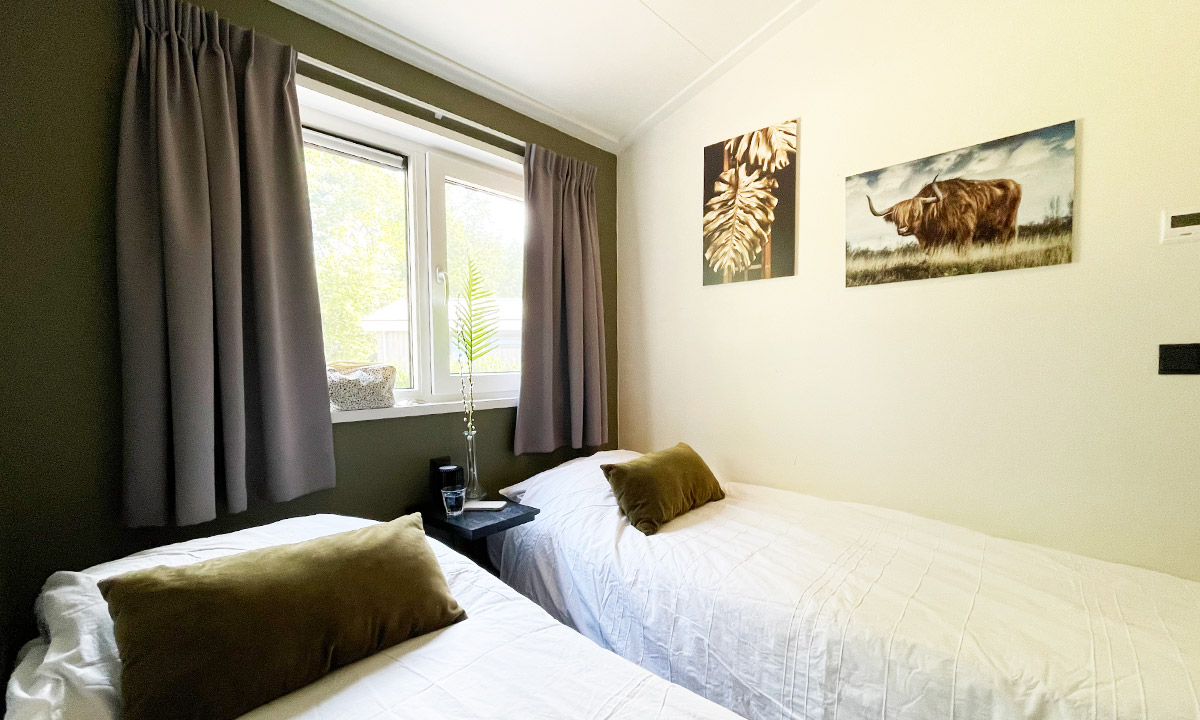 Elke slaapkamer heeft 2 eenpersoonsbedden